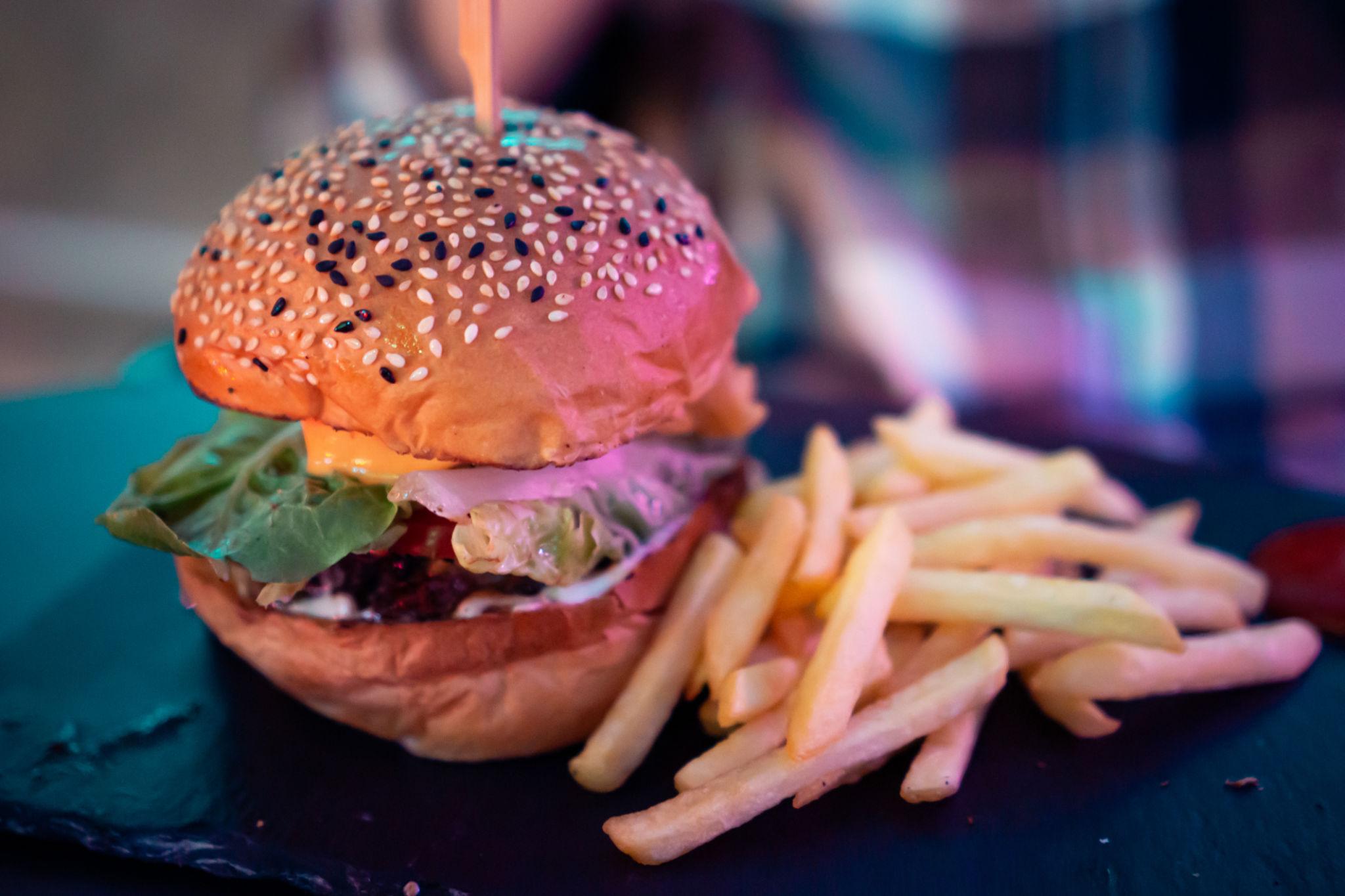 A burger and fries served on a table